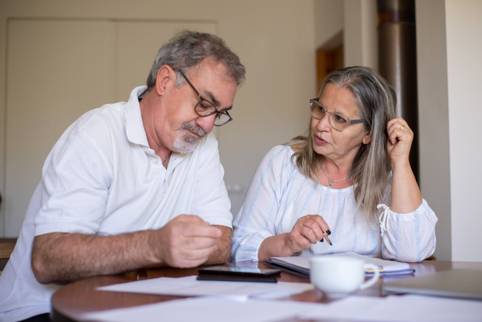 Senior couple reviewing timeshare paperwork together